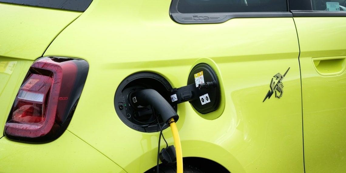 an electric car being charged by a charger