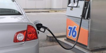 a car is parked at a gas pump